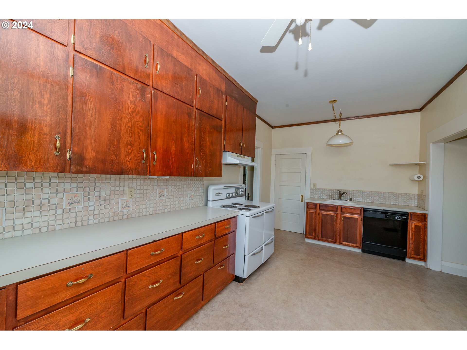 1306 Northeast Birch Street Camas, WA 98607 - Photo 11 of 23 a kitchen with stainless steel appliances granite countertop a sink dishwasher stove and cabinets