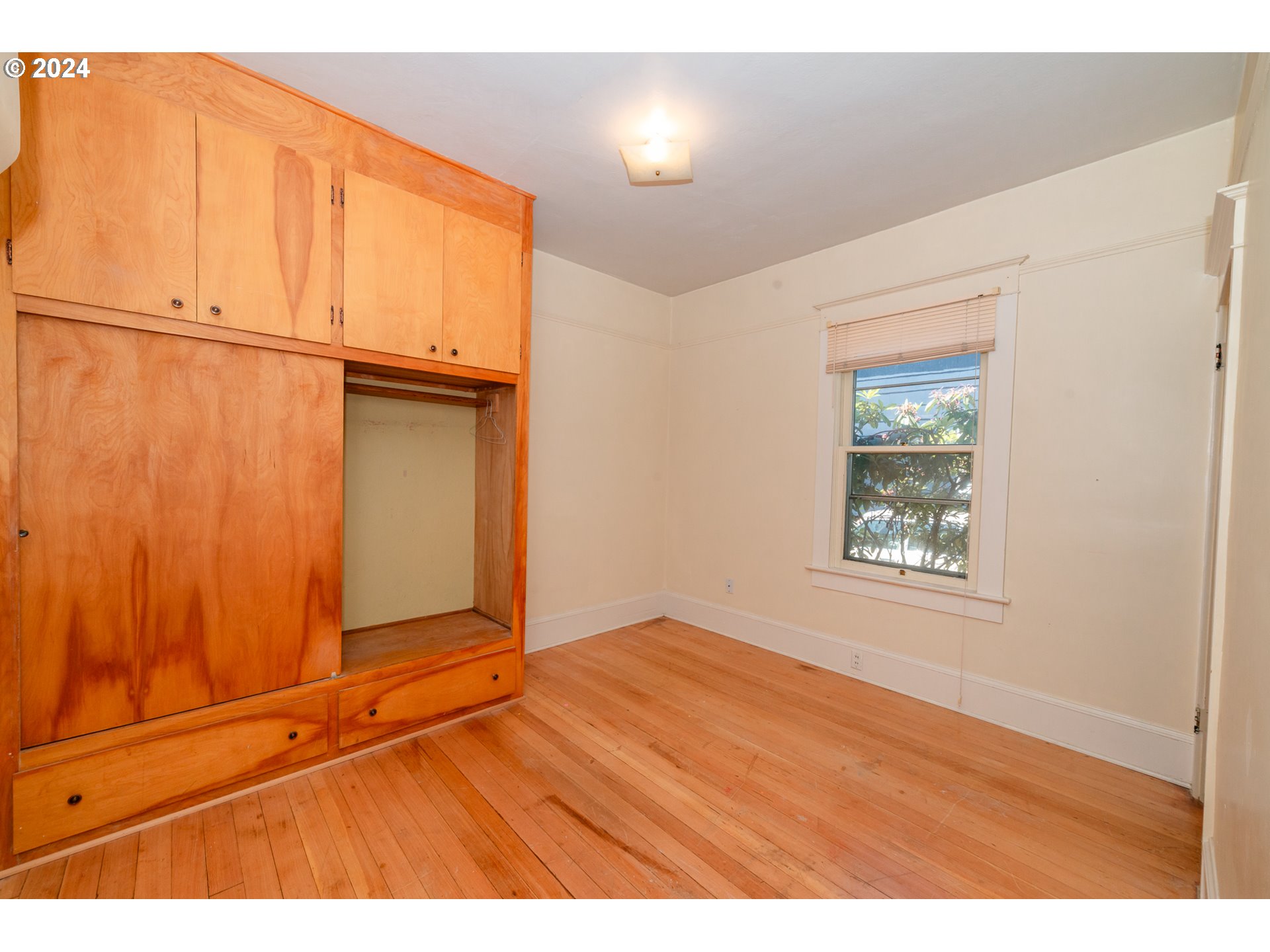 1306 Northeast Birch Street Camas, WA 98607 - Photo 12 of 23 a view of an empty room with wooden floor