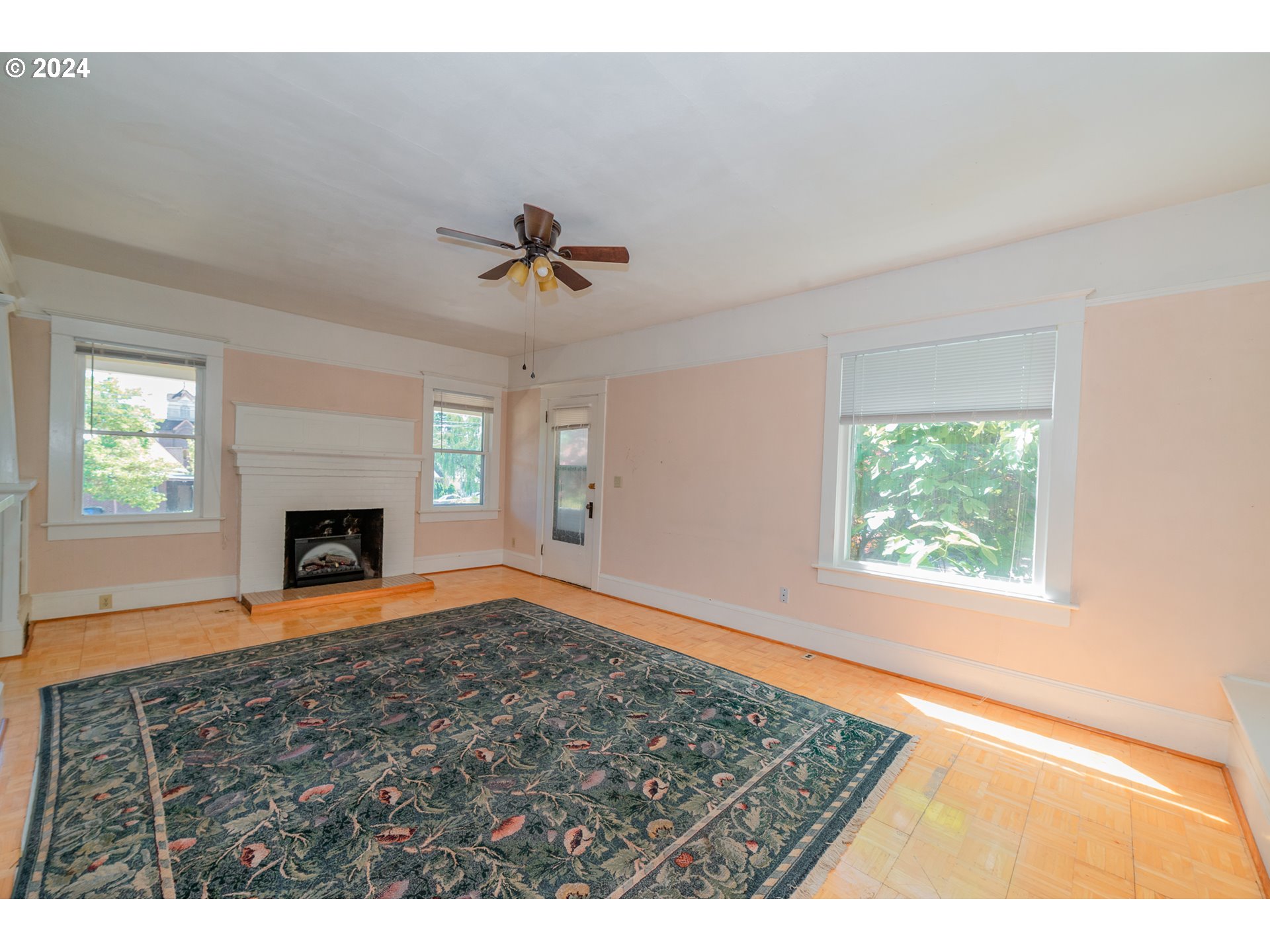 1306 Northeast Birch Street Camas, WA 98607 - Photo 4 of 23 an empty room with windows and fireplace