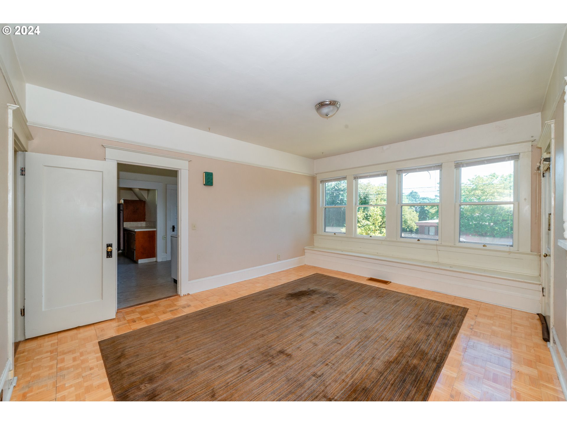 1306 Northeast Birch Street Camas, WA 98607 - Photo 7 of 23 a view of an empty room with wooden floor and a window