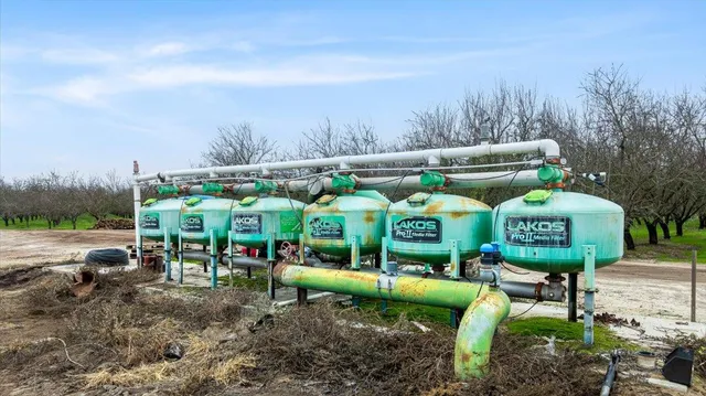 a view of a chairs and table in the yard