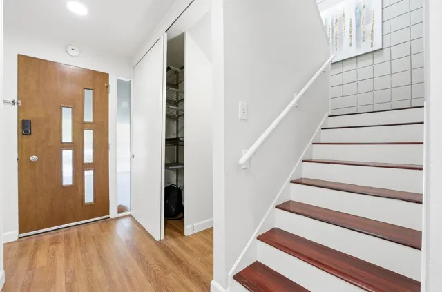 a bed room with a bed and a chair