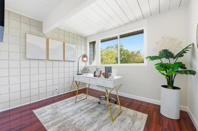 a bedroom with a bed and a table in it