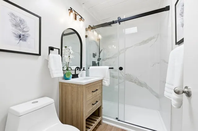 a white bench sitting in front of a house