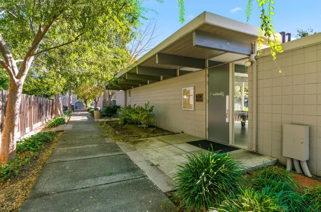 an aerial view of residential house with outdoor space and swimming pool
