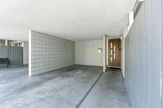 a view of a hallway view with wooden floor and windows