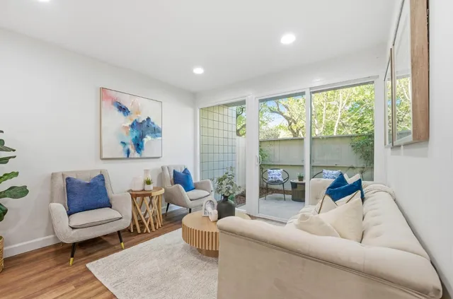 a living room with furniture and a table