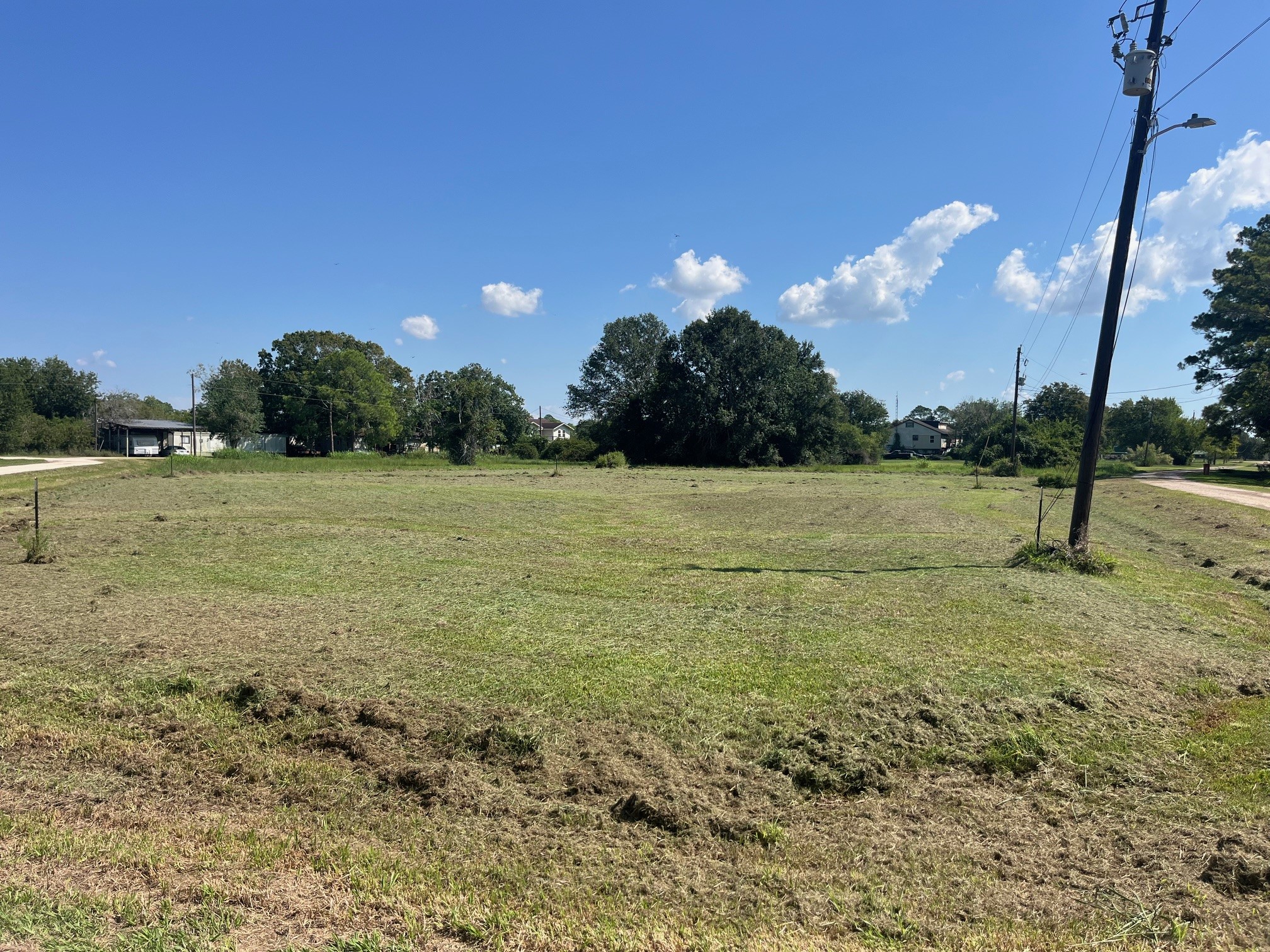 0 Starling Street Palacios, TX 77465 - Photo 3 of 8 a view of a field with trees in background