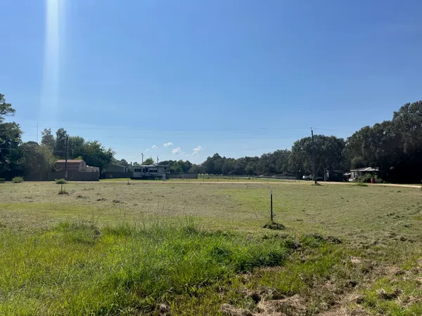 a view of a lake with houses in background