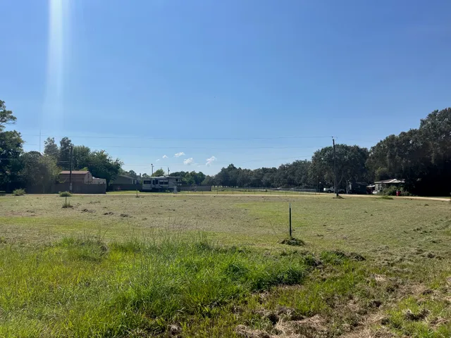 a view of a lake with houses in background