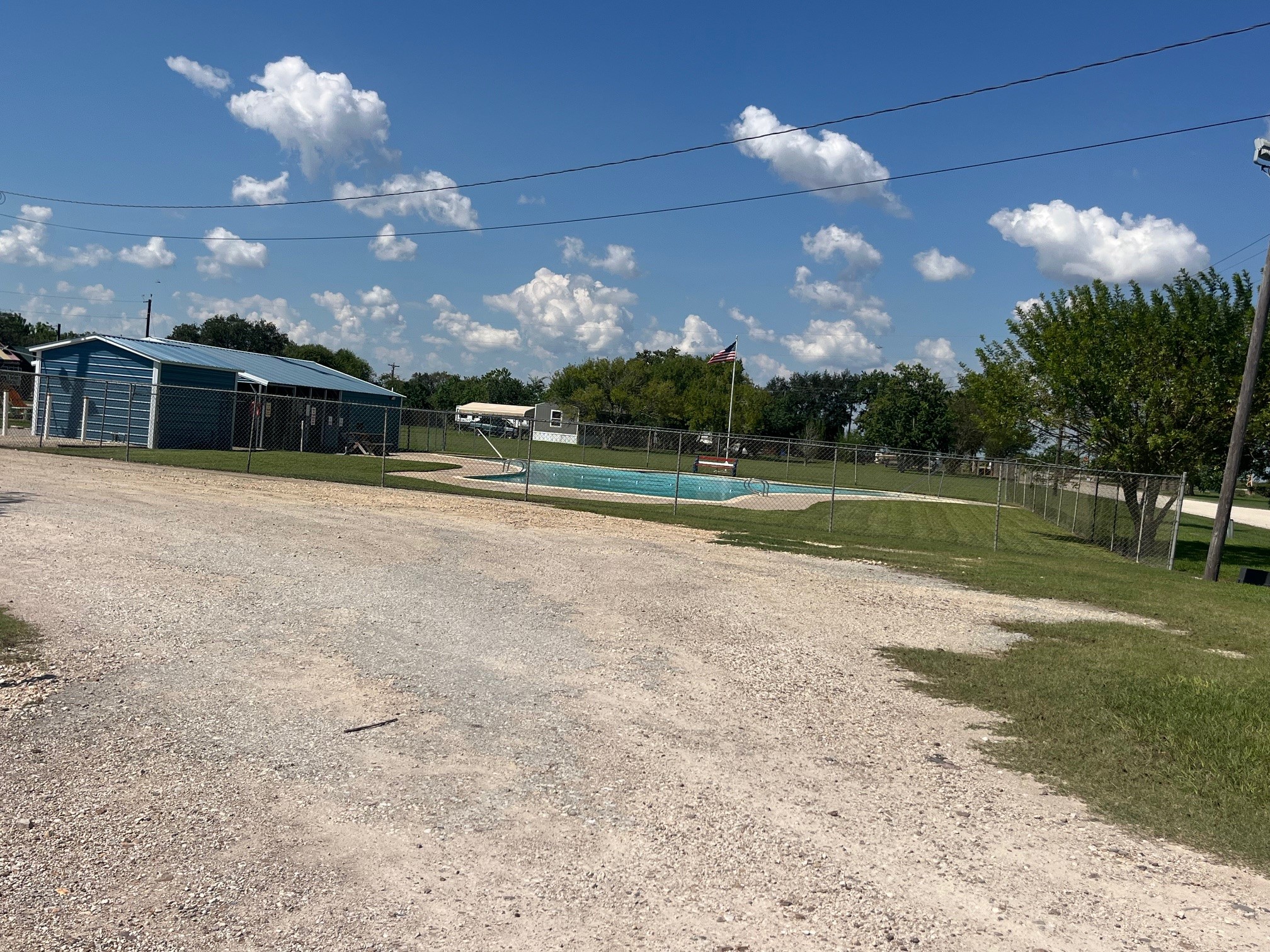0 Starling Street Palacios, TX 77465 - Photo 7 of 8 a view of a fountain in front of a house with a yard