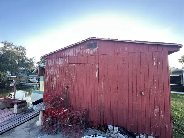 a backyard of a house with outdoor seating