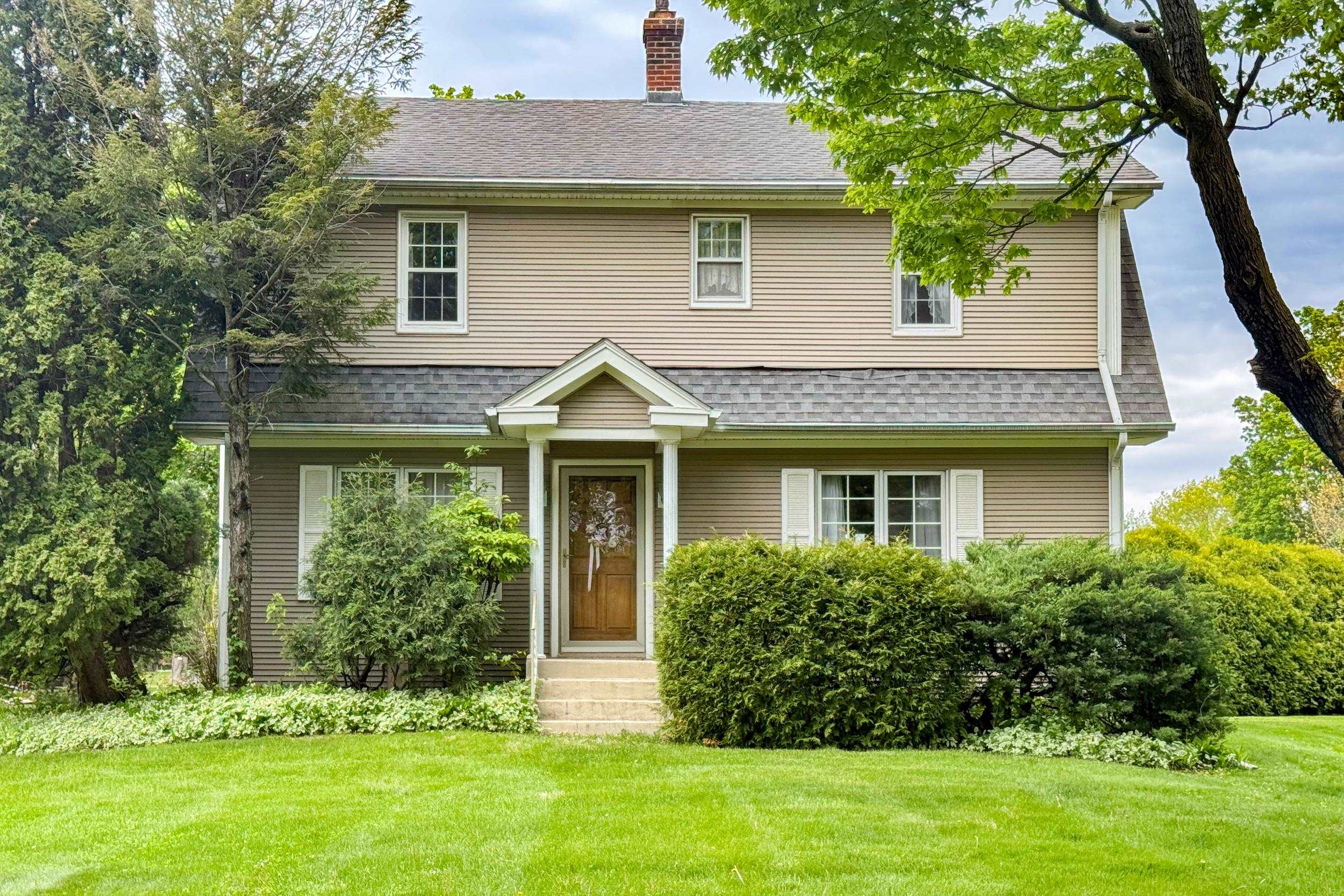 1661 Mill Road Rockford, IL 61108 - Photo 1 of 24 a front view of a house with a yard