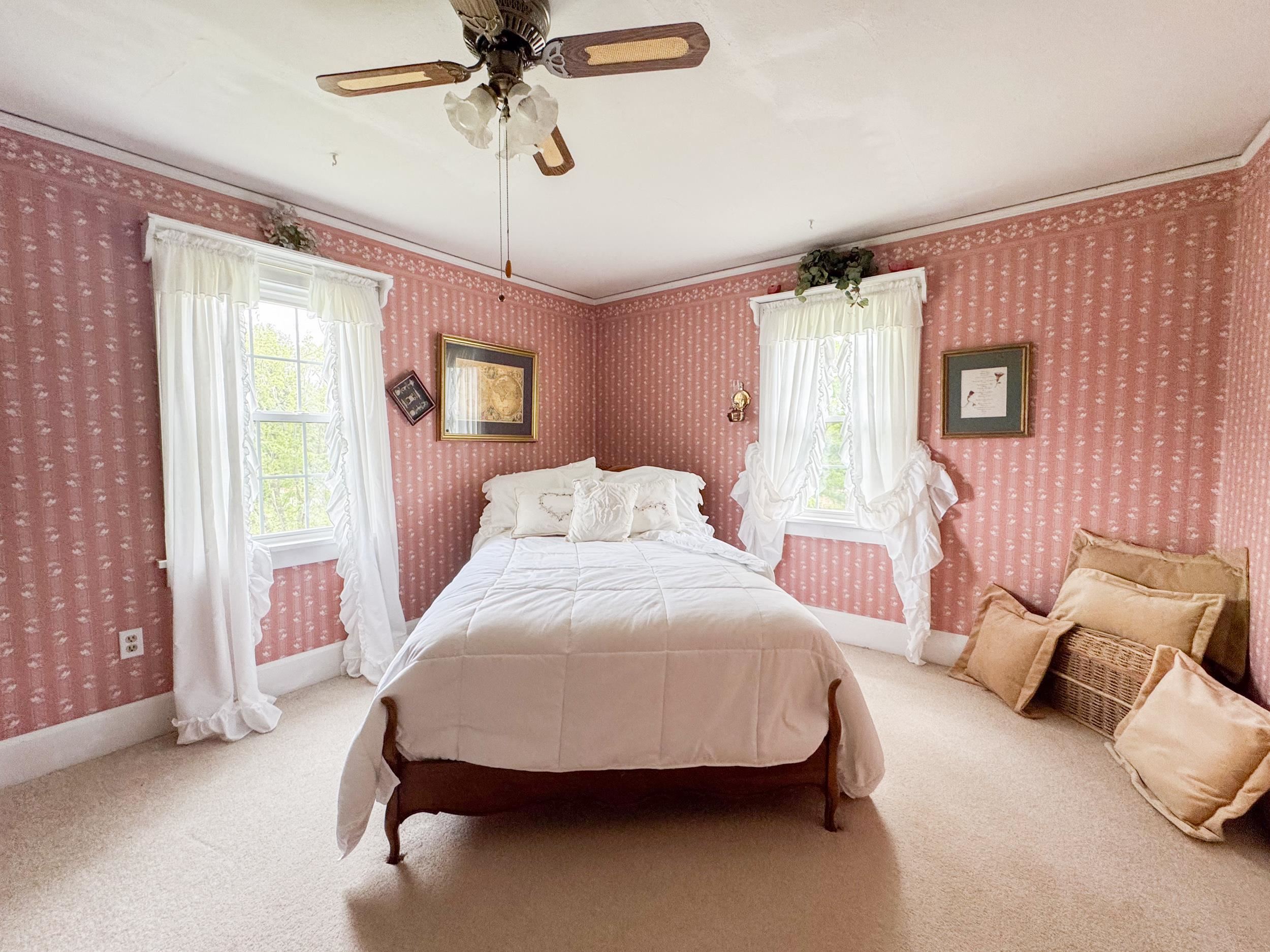 1661 Mill Road Rockford, IL 61108 - Photo 15 of 24 a bedroom with a bed a window and couch