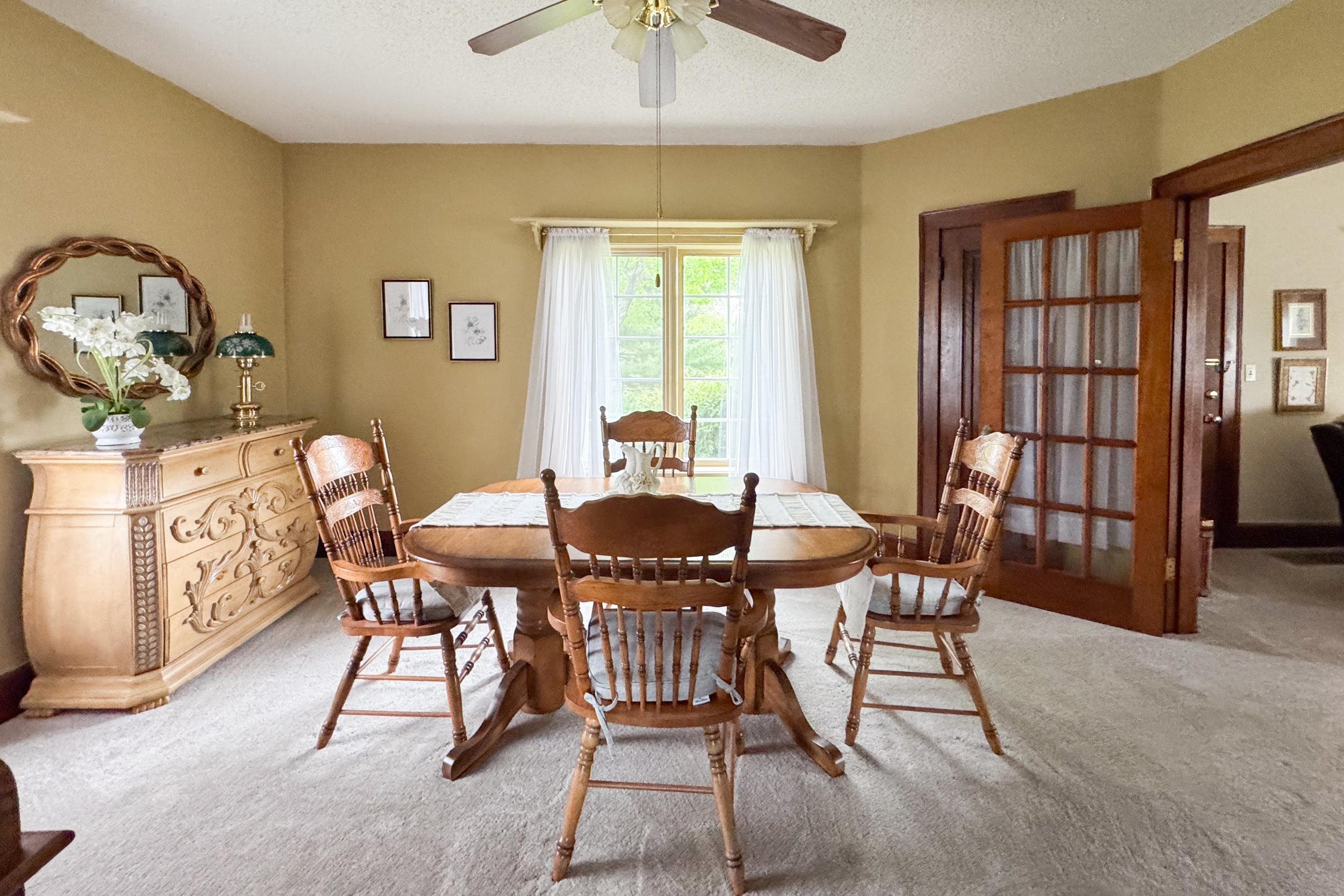 1661 Mill Road Rockford, IL 61108 - Photo 8 of 24 a view of a dining room with furniture window and outside view