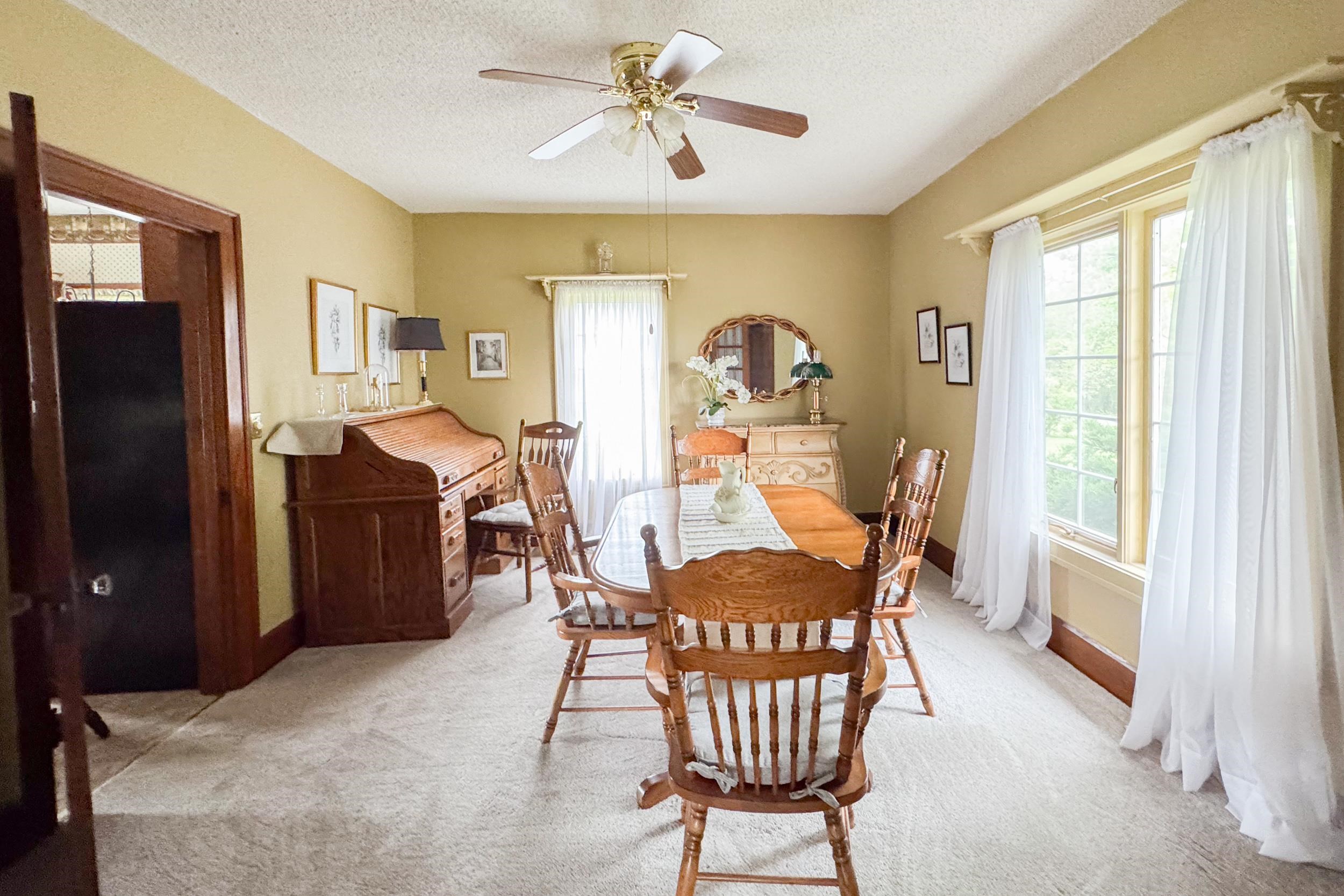 1661 Mill Road Rockford, IL 61108 - Photo 9 of 24 a dining room with furniture and window