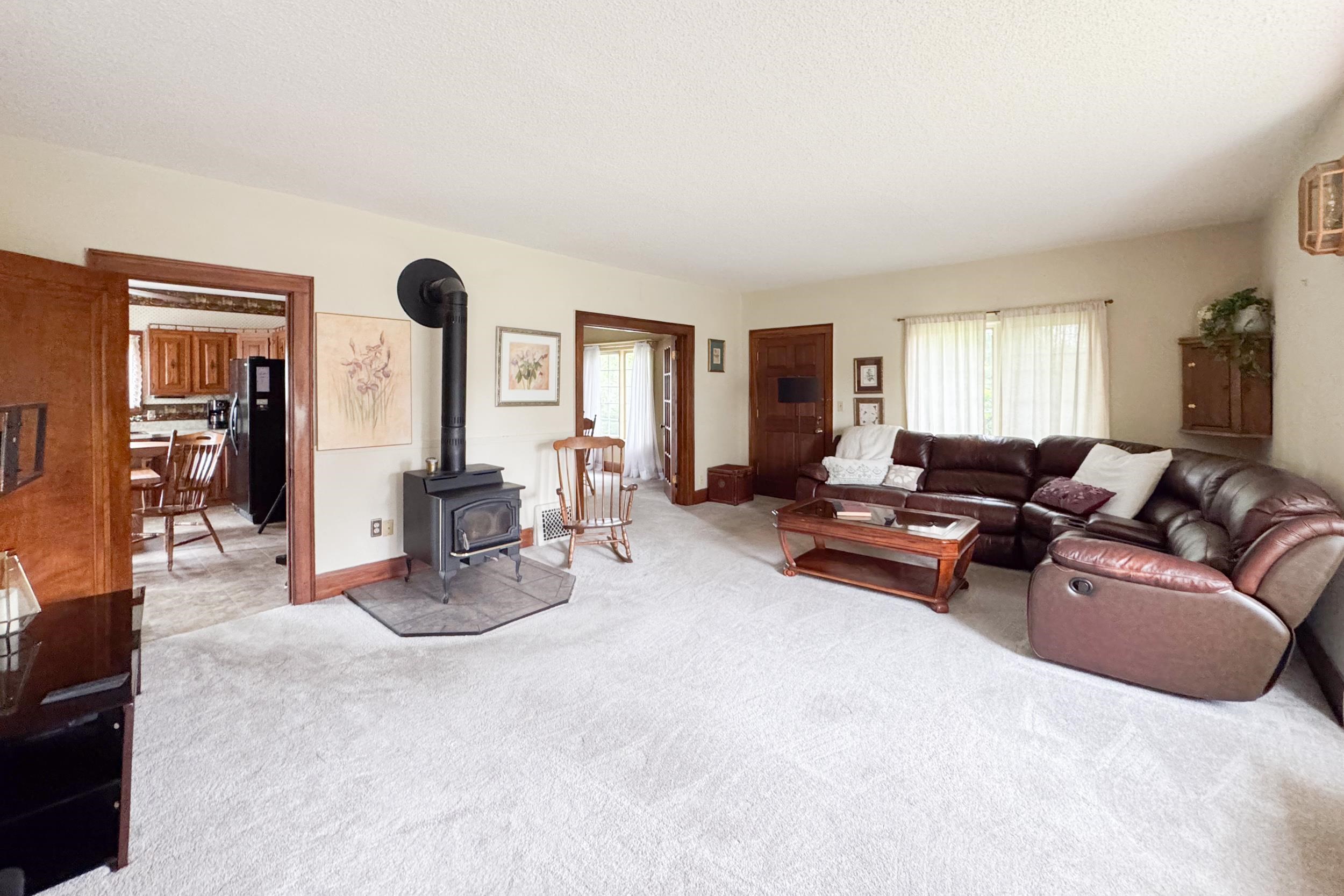 1661 Mill Road Rockford, IL 61108 - Photo 10 of 24 a living room with furniture and a table