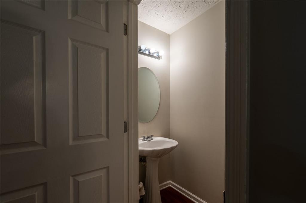 3474 Waldrop Trail Decatur, GA 30034 - Photo 13 of 17 a bathroom with a light fixture and a sink
