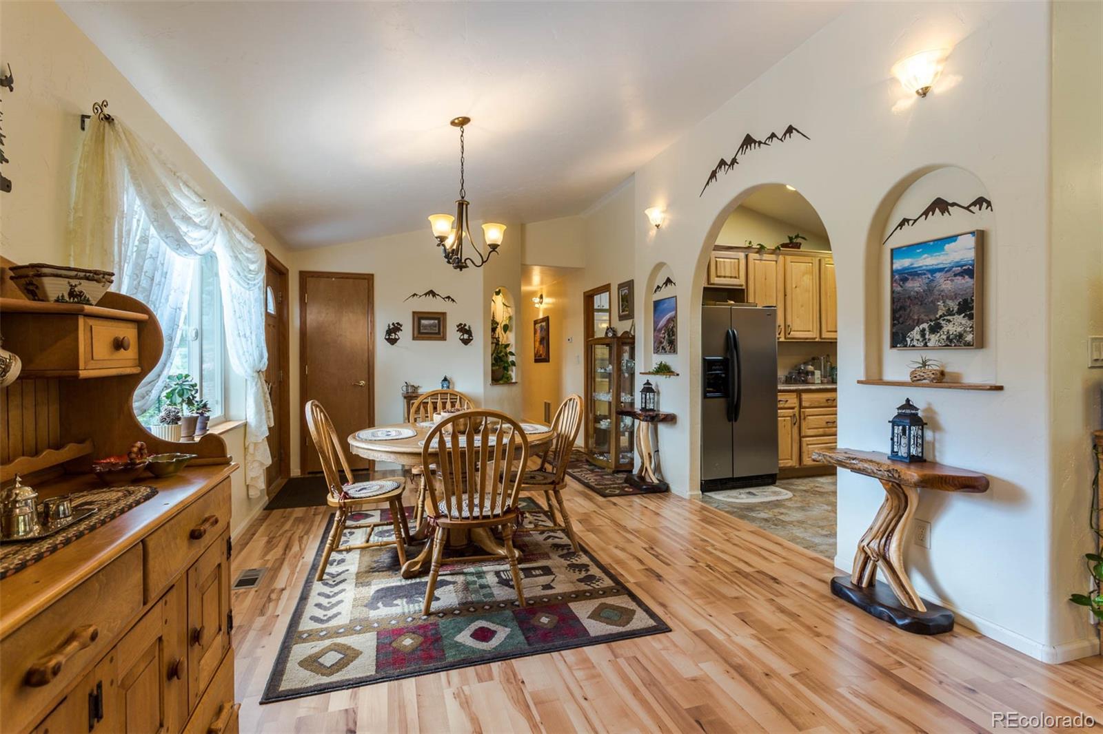 32147 Sylvan Road Golden, CO 80403 - Photo 11 of 27 a view of a kitchen and dining room