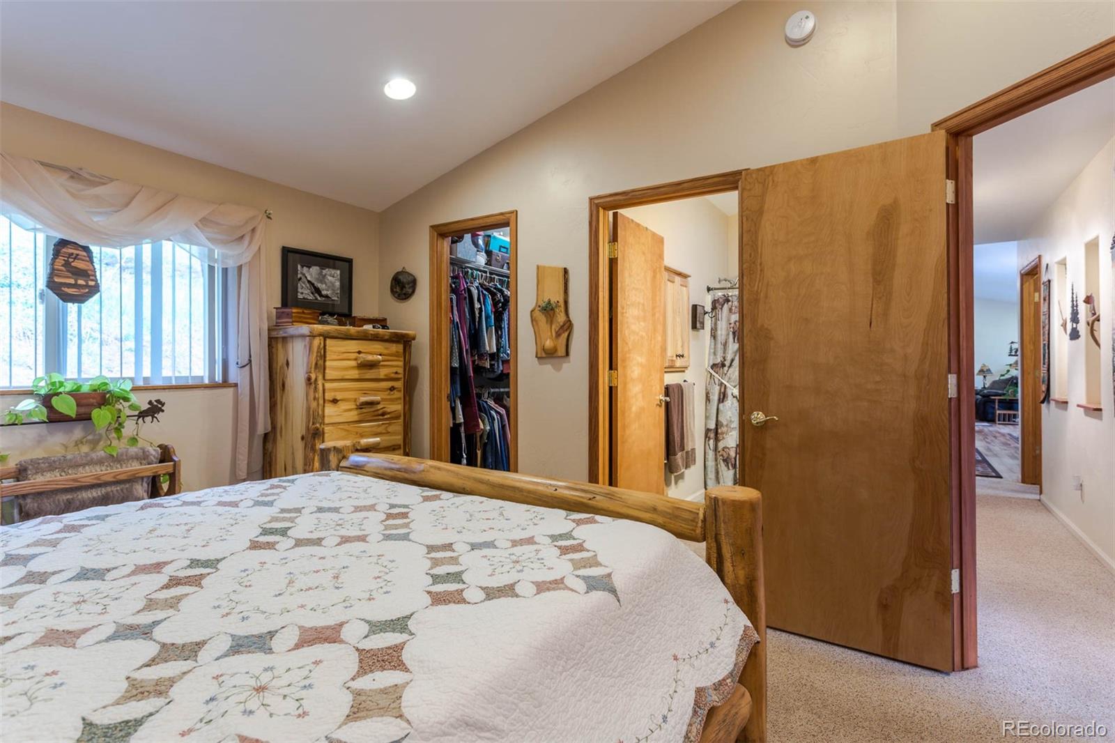 32147 Sylvan Road Golden, CO 80403 - Photo 18 of 27 a bedroom with a bed and a dresser