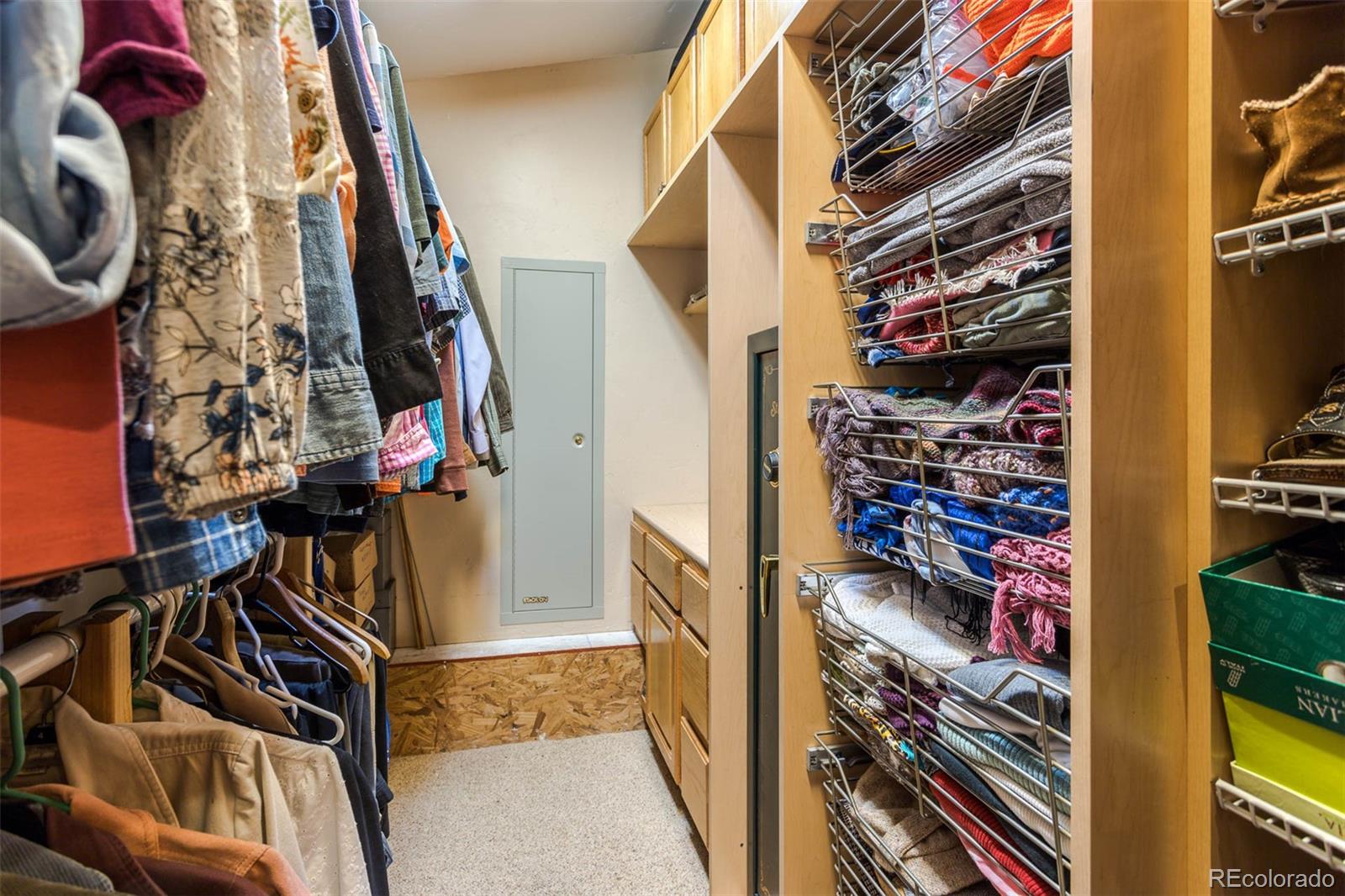 32147 Sylvan Road Golden, CO 80403 - Photo 20 of 27 a view of walk in closet with clothes and shoes