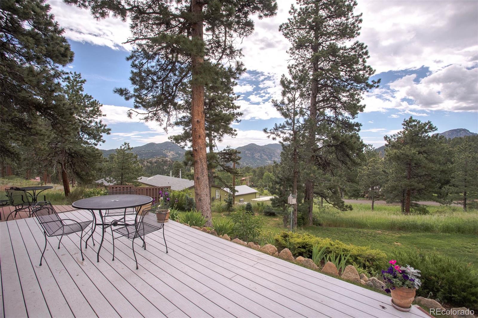 32147 Sylvan Road Golden, CO 80403 - Photo 5 of 27 a view of a yard with furniture and garden
