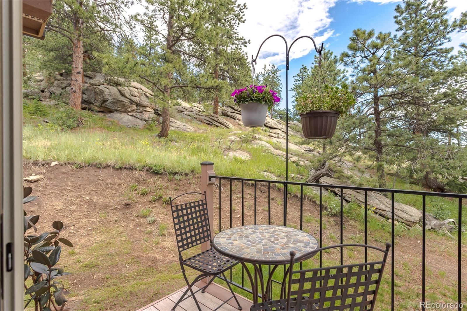 32147 Sylvan Road Golden, CO 80403 - Photo 10 of 27 a view of a balcony with furniture