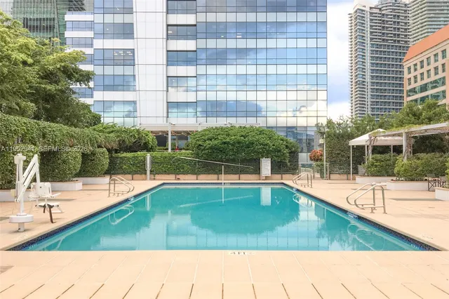 a view of a swimming pool with a patio