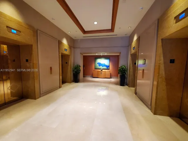 a view of an empty room with a fireplace