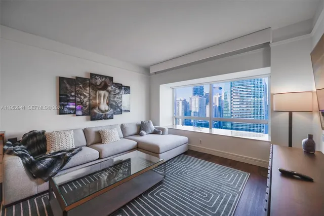 a living room with furniture and a large window