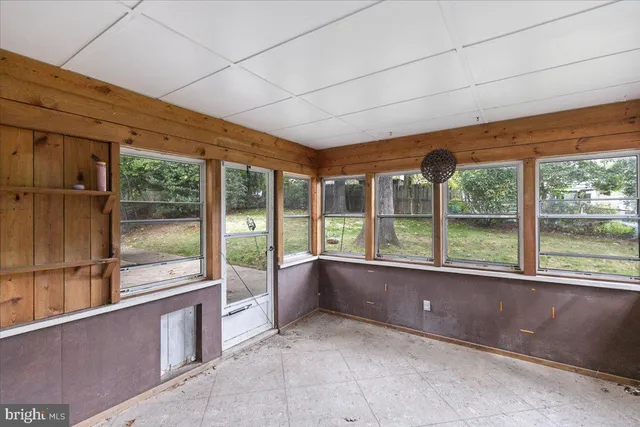 a view of an empty room with a large window