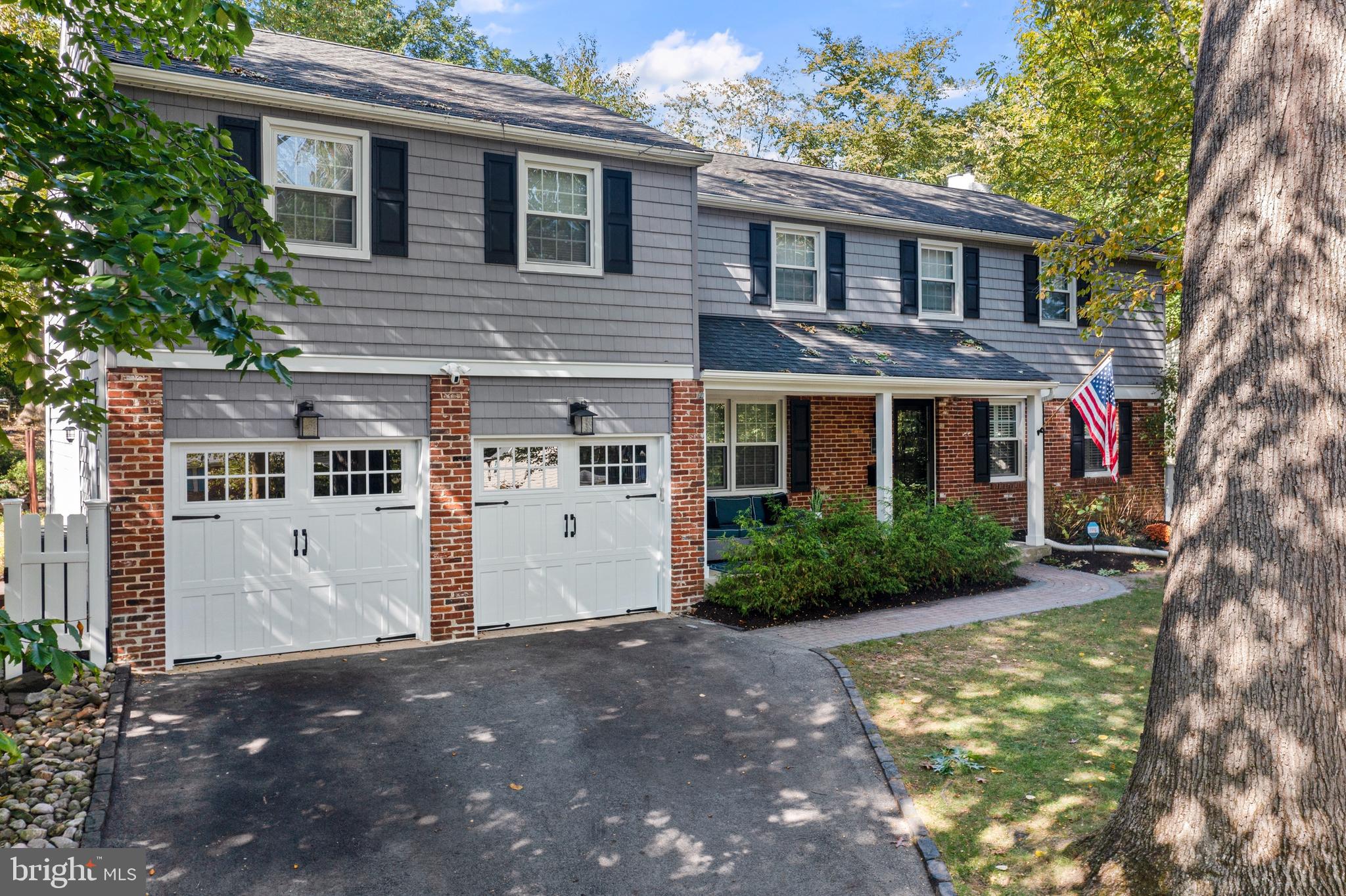 66 Oakford Road Wayne, PA 19087 - Photo 1 of 63 a front view of a house with garden