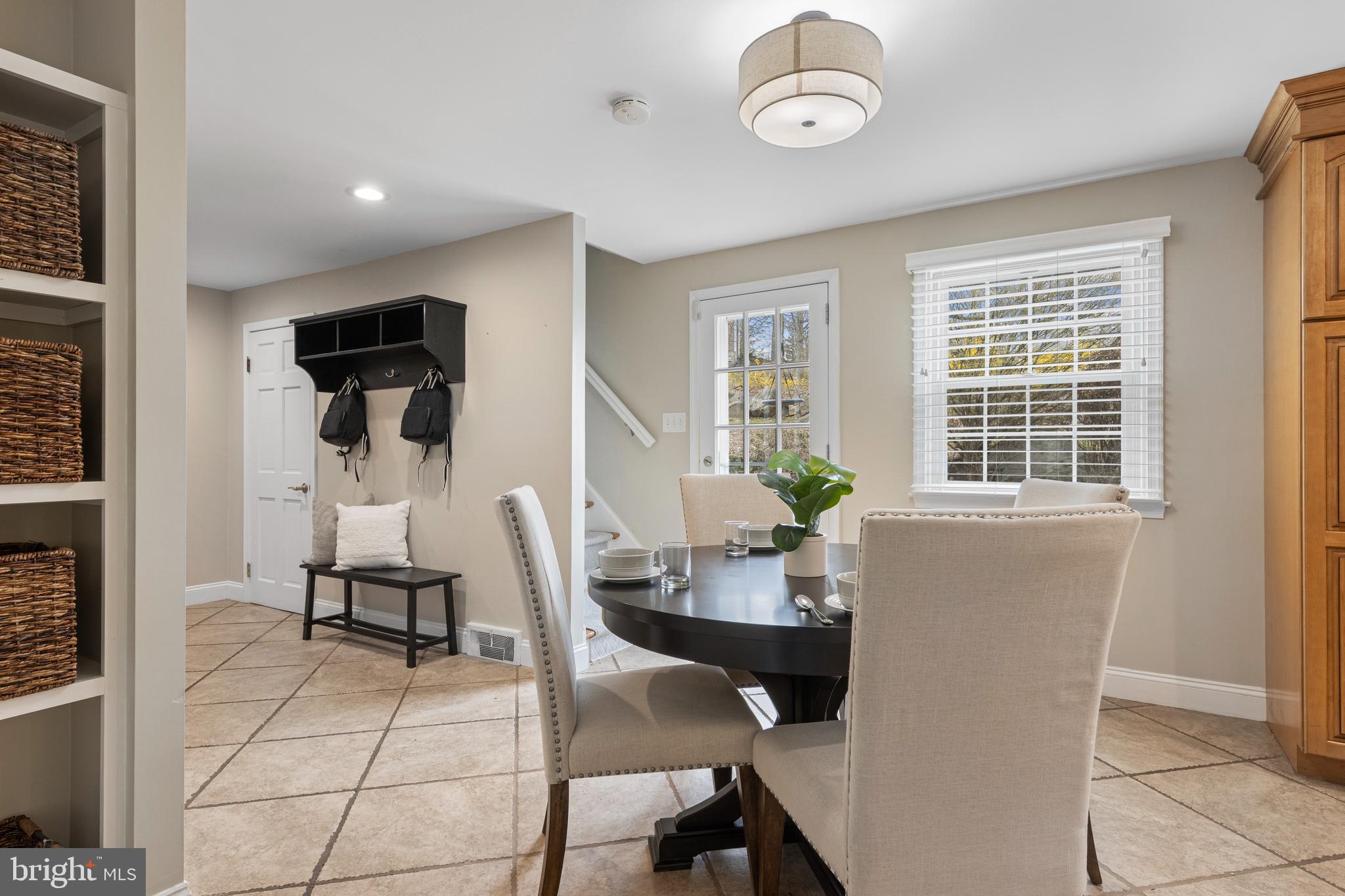 66 Oakford Road Wayne, PA 19087 - Photo 22 of 63 a view of a dining room with furniture and a window