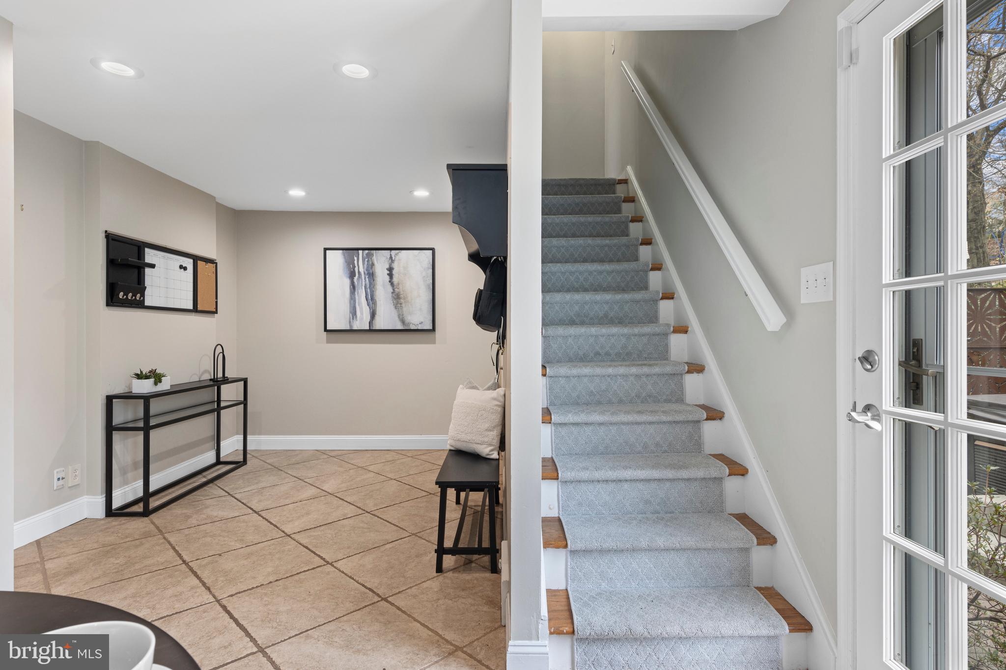 66 Oakford Road Wayne, PA 19087 - Photo 23 of 63 a view of staircase with white walls and black furniture