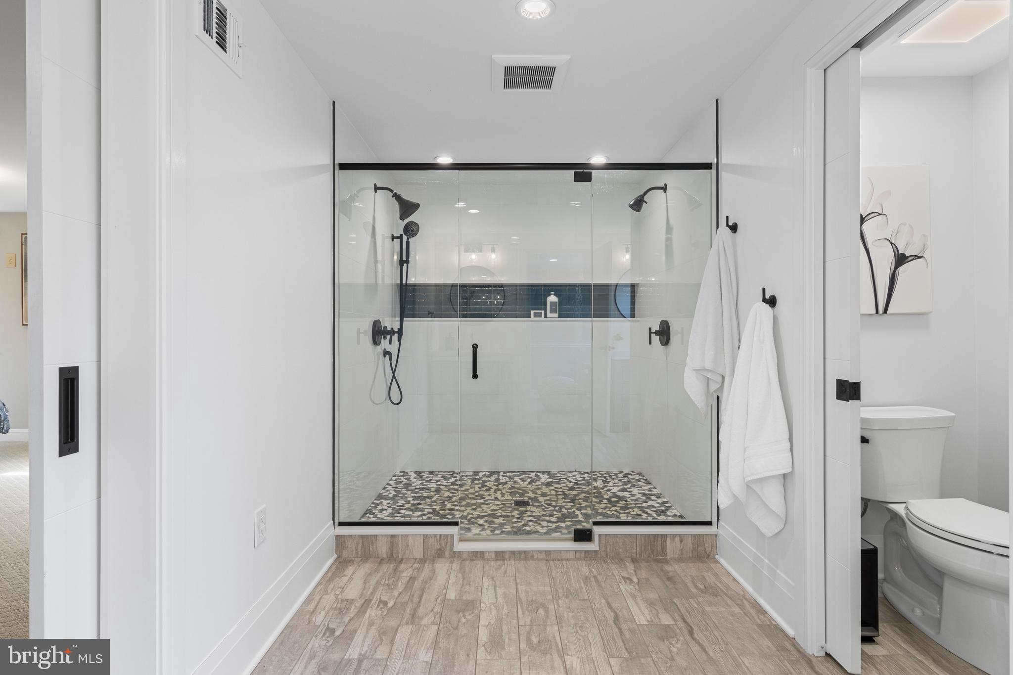 66 Oakford Road Wayne, PA 19087 - Photo 34 of 63 a bathroom with a glass shower door