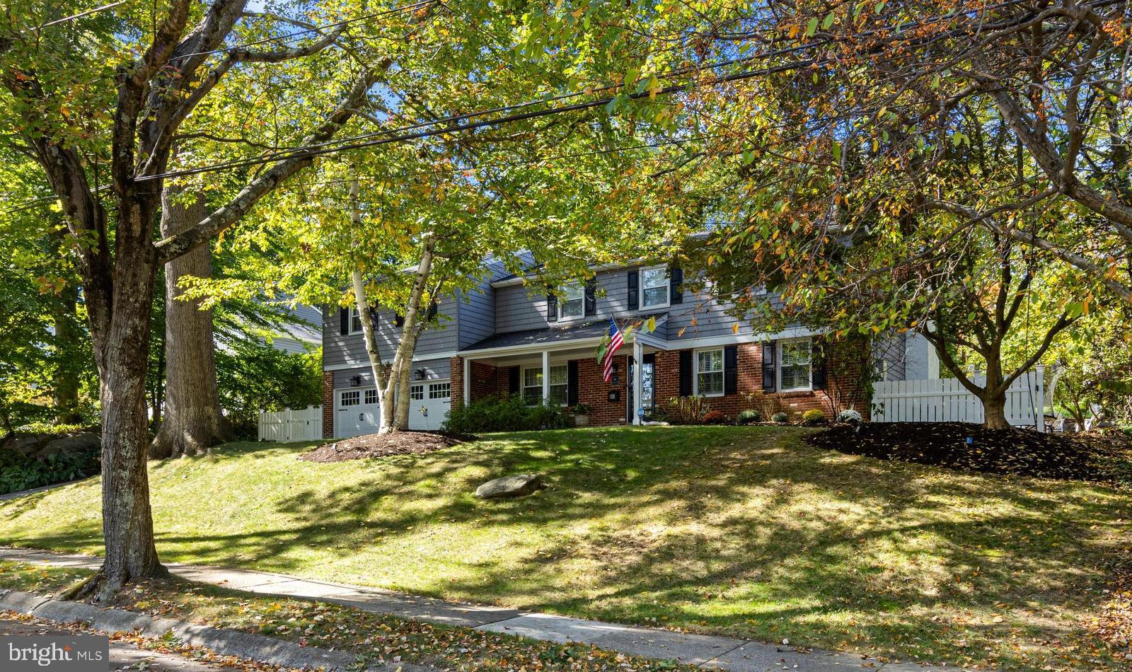 66 Oakford Road Wayne, PA 19087 - Photo 4 of 63 a front view of a house with a yard