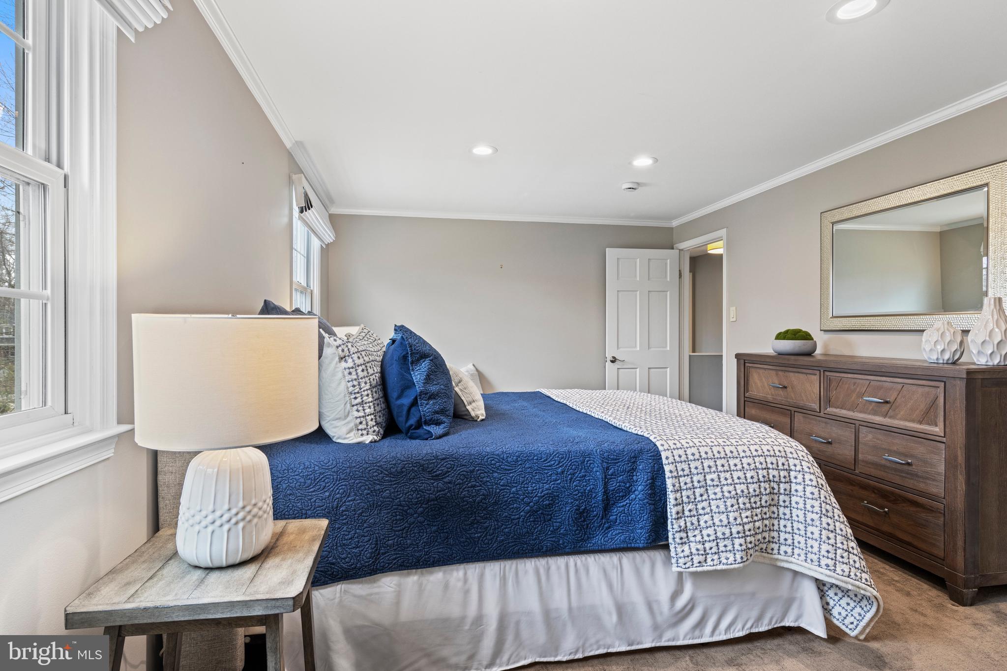 66 Oakford Road Wayne, PA 19087 - Photo 45 of 63 a bedroom with a bed and dresser with mirror