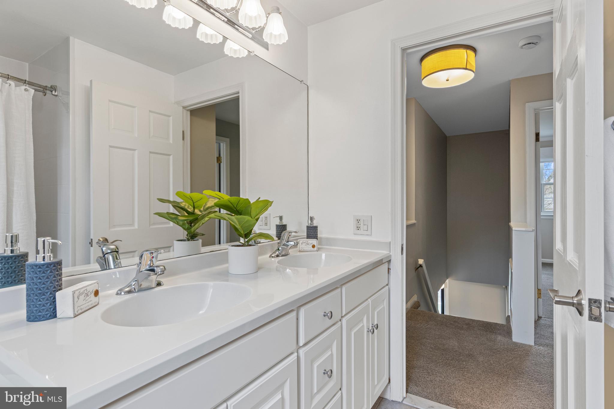 66 Oakford Road Wayne, PA 19087 - Photo 47 of 63 a bathroom with a sink and a mirror
