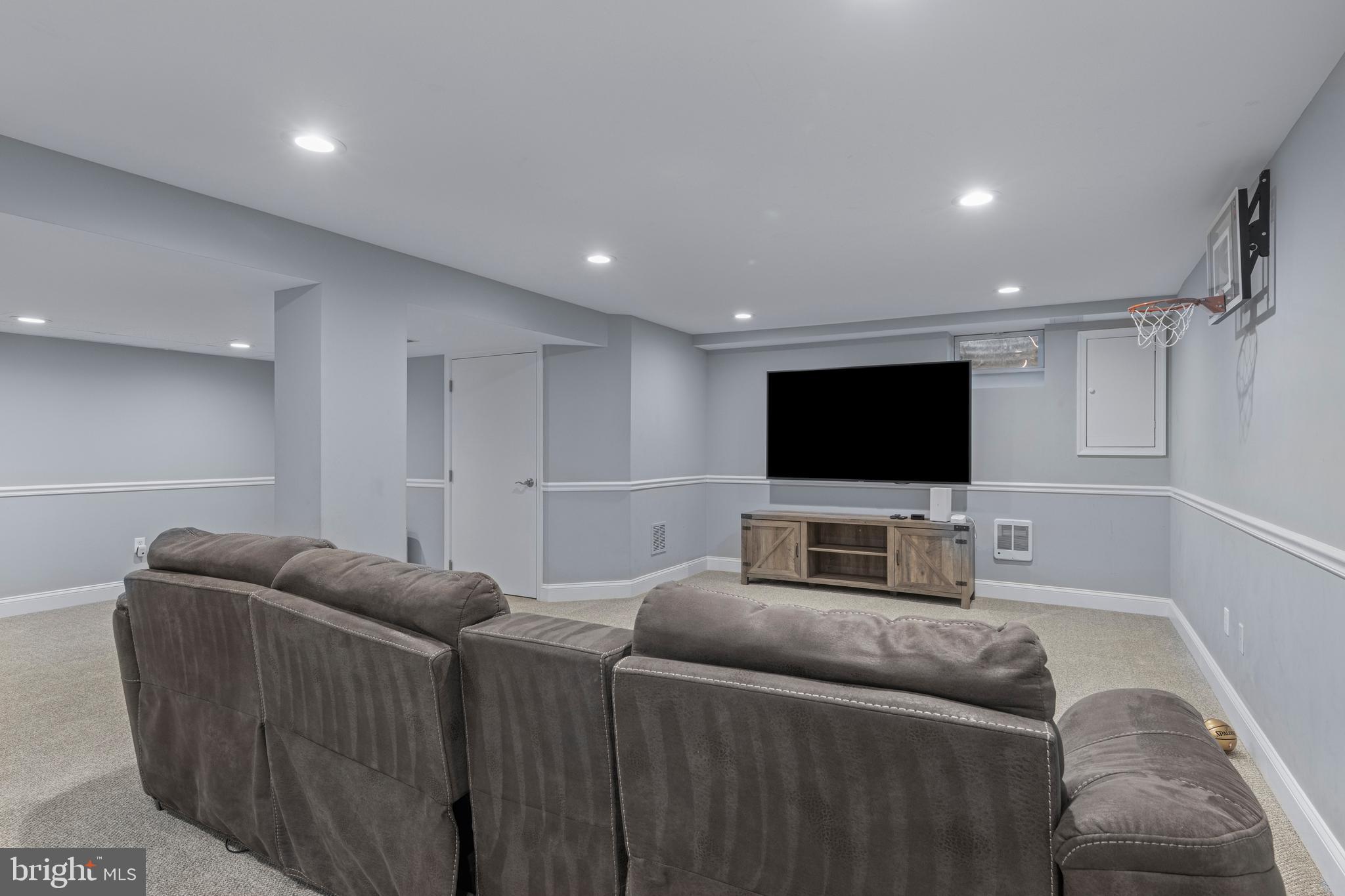 66 Oakford Road Wayne, PA 19087 - Photo 48 of 63 a living room with furniture and a flat screen tv