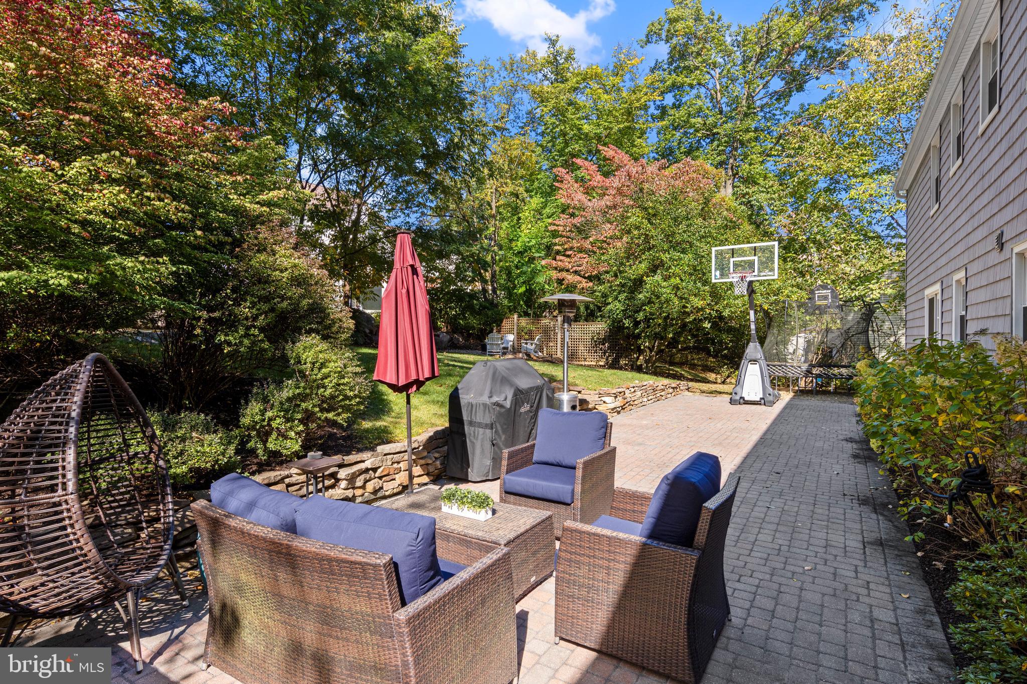 66 Oakford Road Wayne, PA 19087 - Photo 52 of 63 a view of backyard with outdoor seating and plants