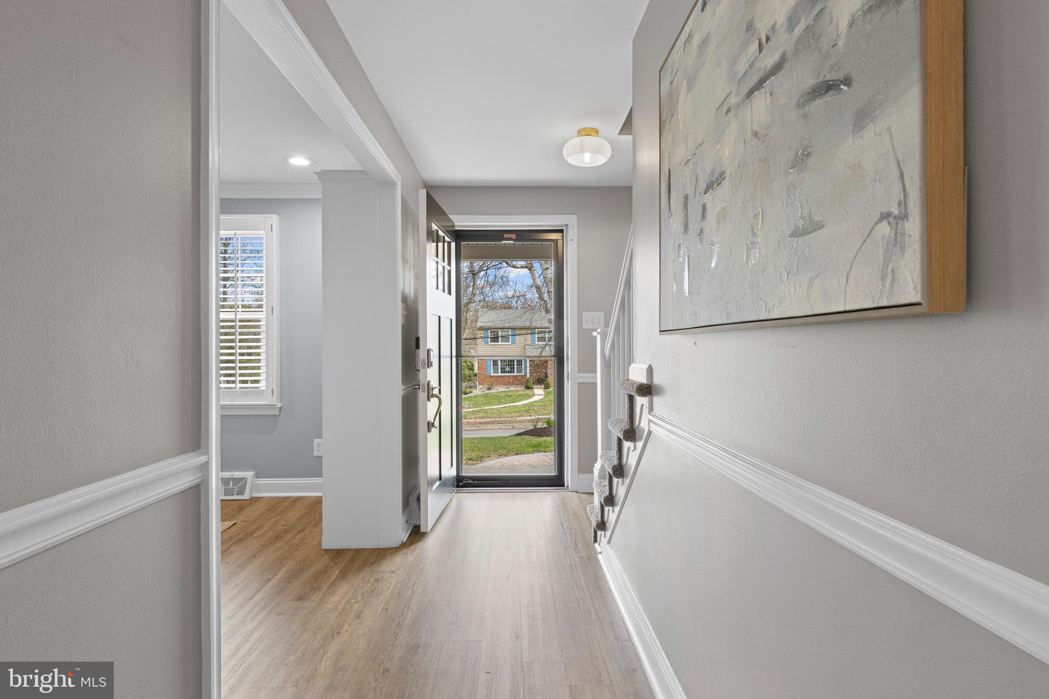 66 Oakford Road Wayne, PA 19087 - Photo 8 of 63 a view of a hallway view with wooden floor and staircase