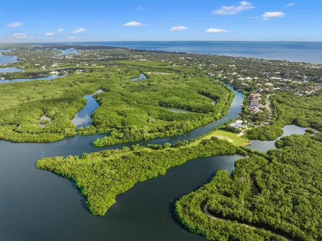 an aerial view of a golf course with an outdoor space