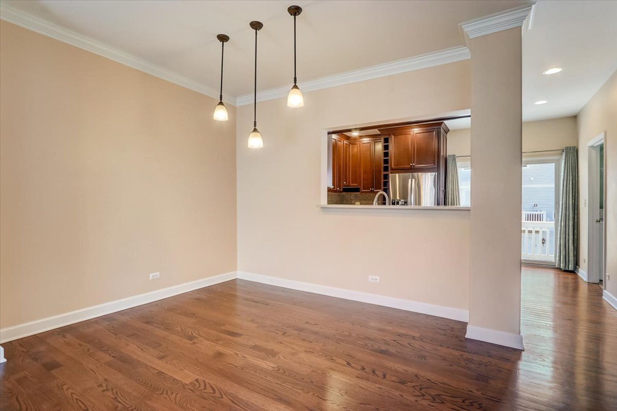 3372 Ravinia Circle Aurora, IL 60504 - Photo 11 of 39 a view of a room with wooden floor and window