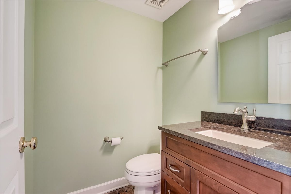 3372 Ravinia Circle Aurora, IL 60504 - Photo 15 of 39 a bathroom with a granite countertop sink a toilet and a mirror