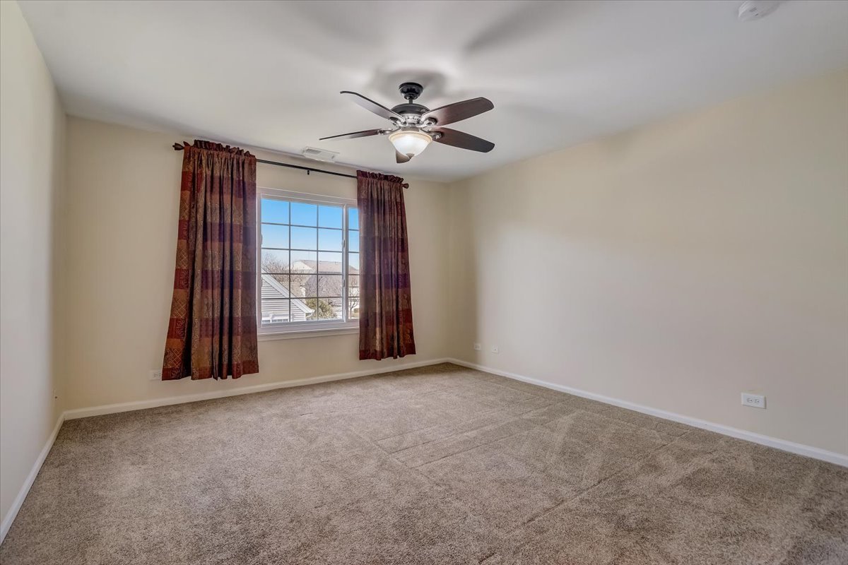 3372 Ravinia Circle Aurora, IL 60504 - Photo 20 of 39 a view of an empty room with a window