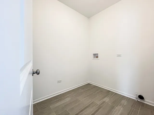 a view of a small space with wooden floor