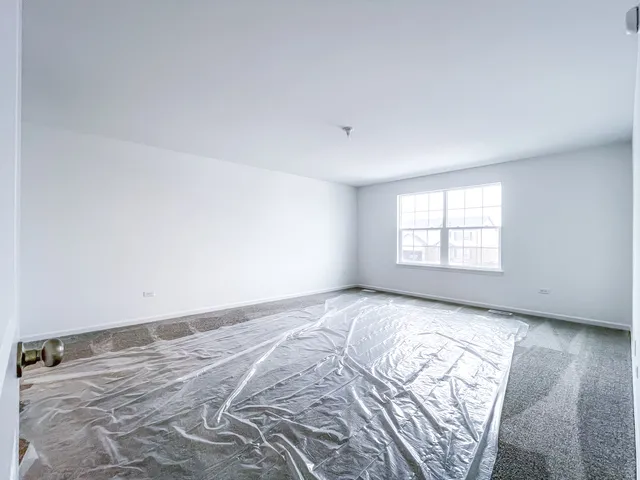 an empty room with a bed