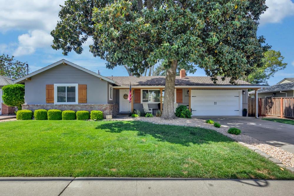front view of a house with a yard