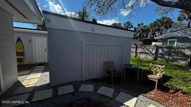 a backyard of a house with outdoor seating