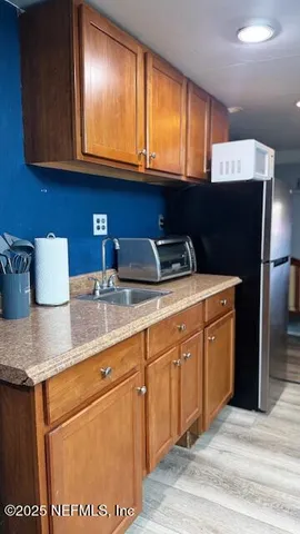 a bathroom with a sink toilet and mirror